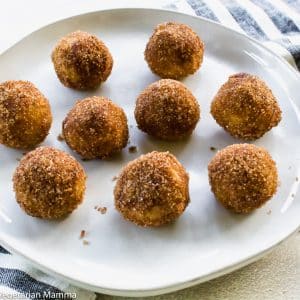 gluten free vegan donut hols on a white plate