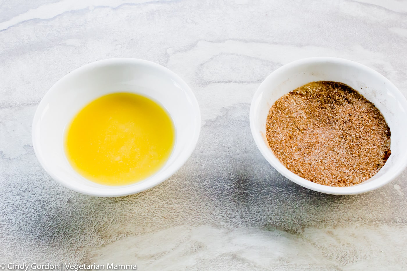 butter and sugar and cinnamon in bowls for donut dipping