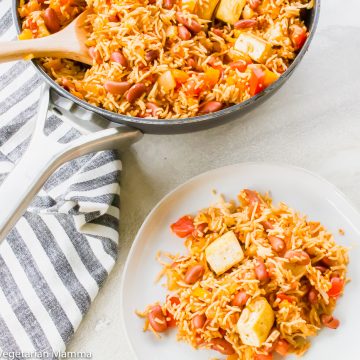Tofu with spanish rice and bean shown in a skillet and on a white plate