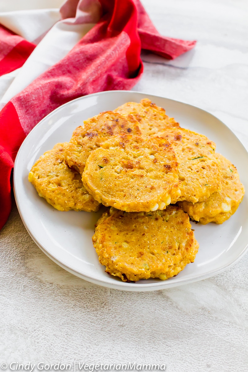 Zucchini corn Cakes or Zucchini Fritters can be served plain or with sour cream and chives.