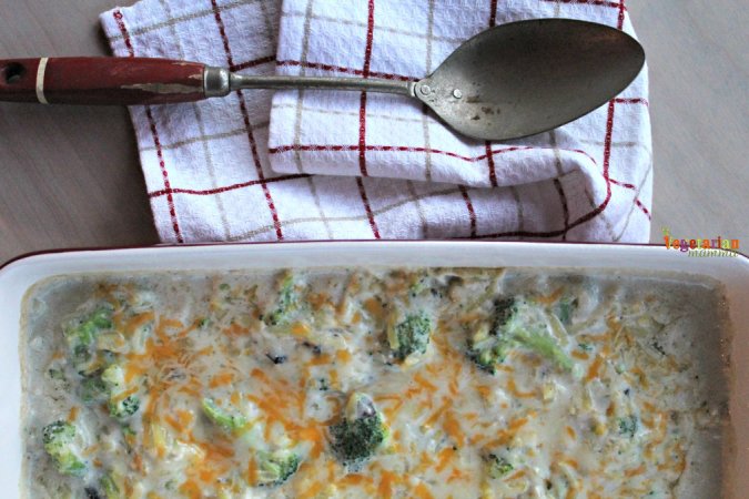 Cheesy Broccoli Casserole dish with a spoon