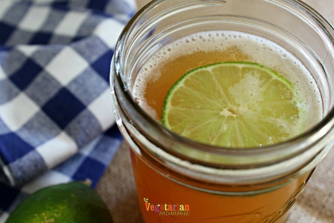 mason jar of summer beer with a slice of lime in it