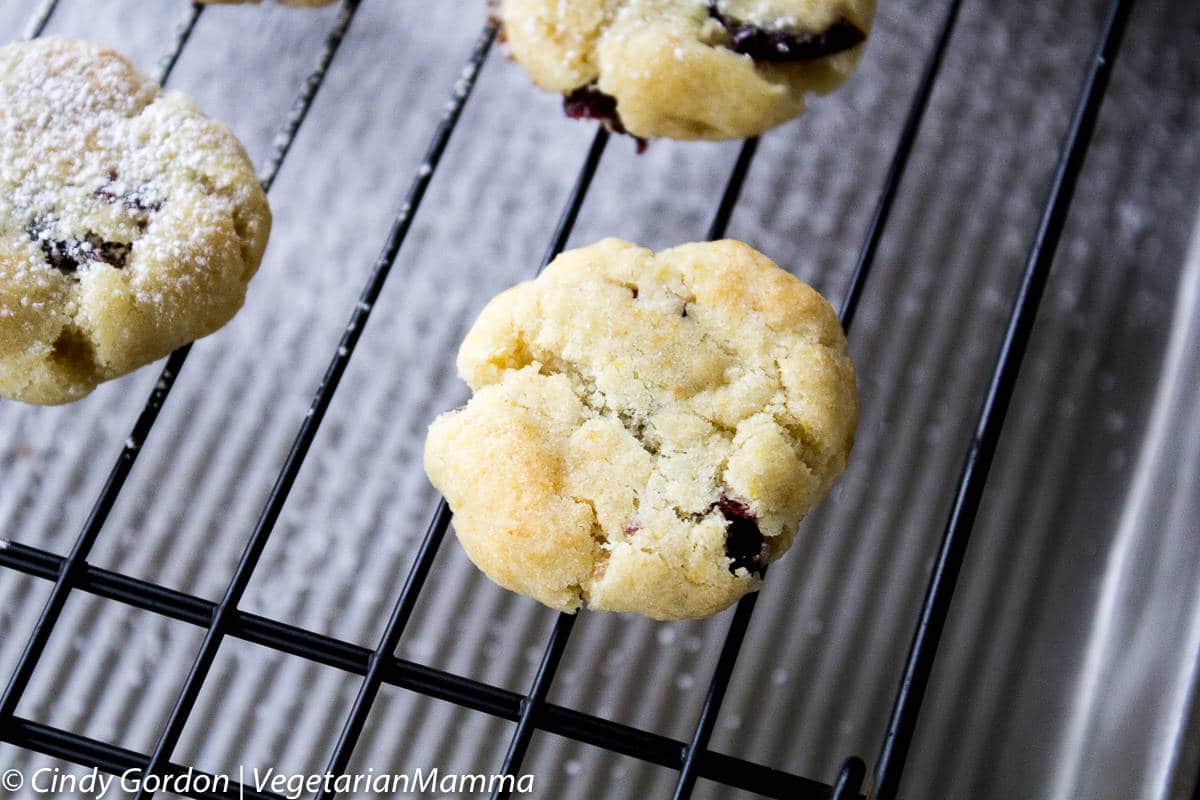 Gluten Free Lemon Cranberry Cookies cooking on a baking rack
