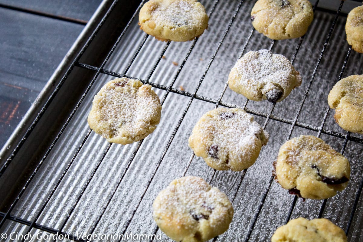  Lemon Cranberry Cookies on baking rack with powdered sugar