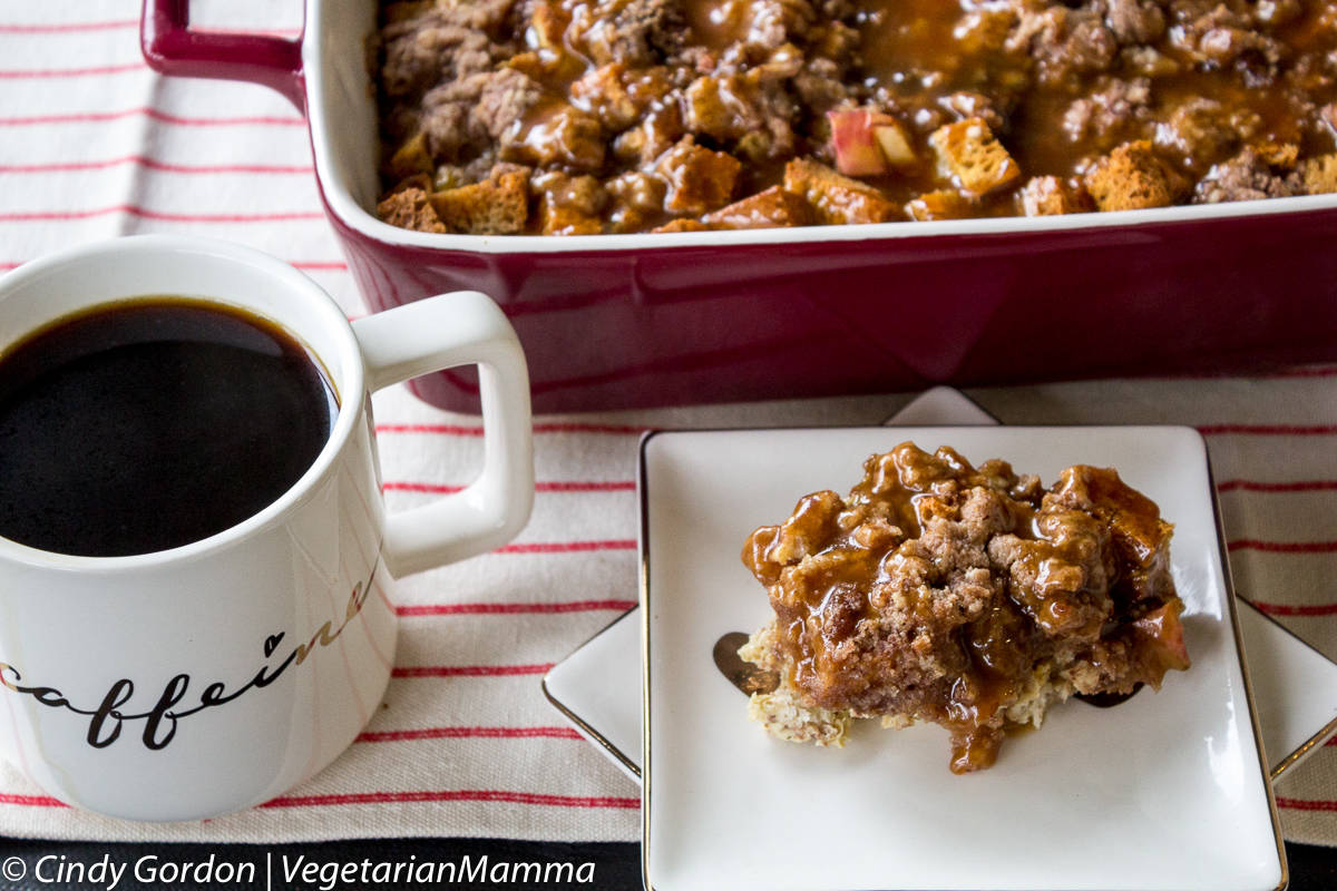 apple french toast casserole on a plate with a cup of coffee