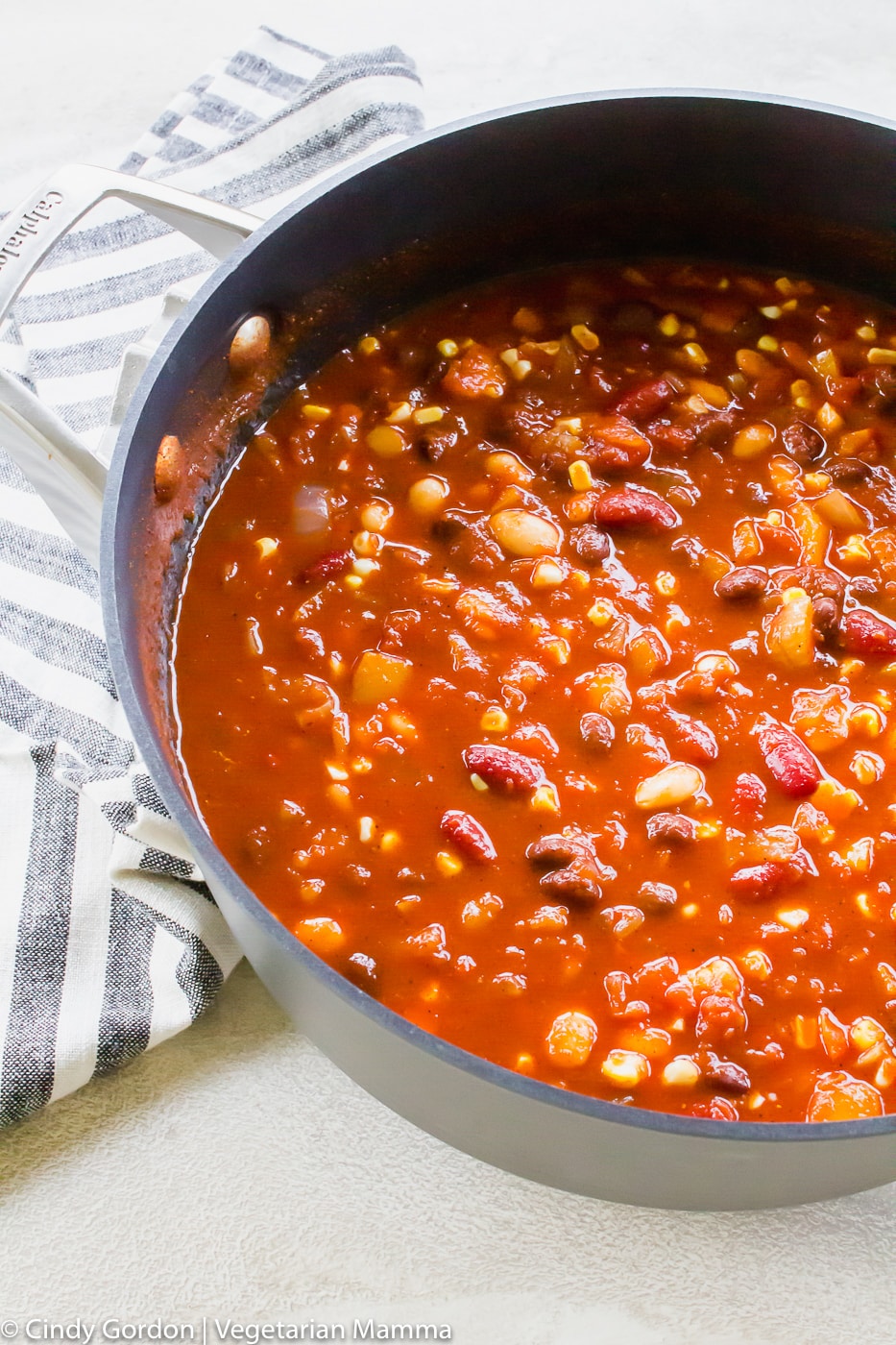 vertical shot of vegetarian sweet chili in a large skillet bowl