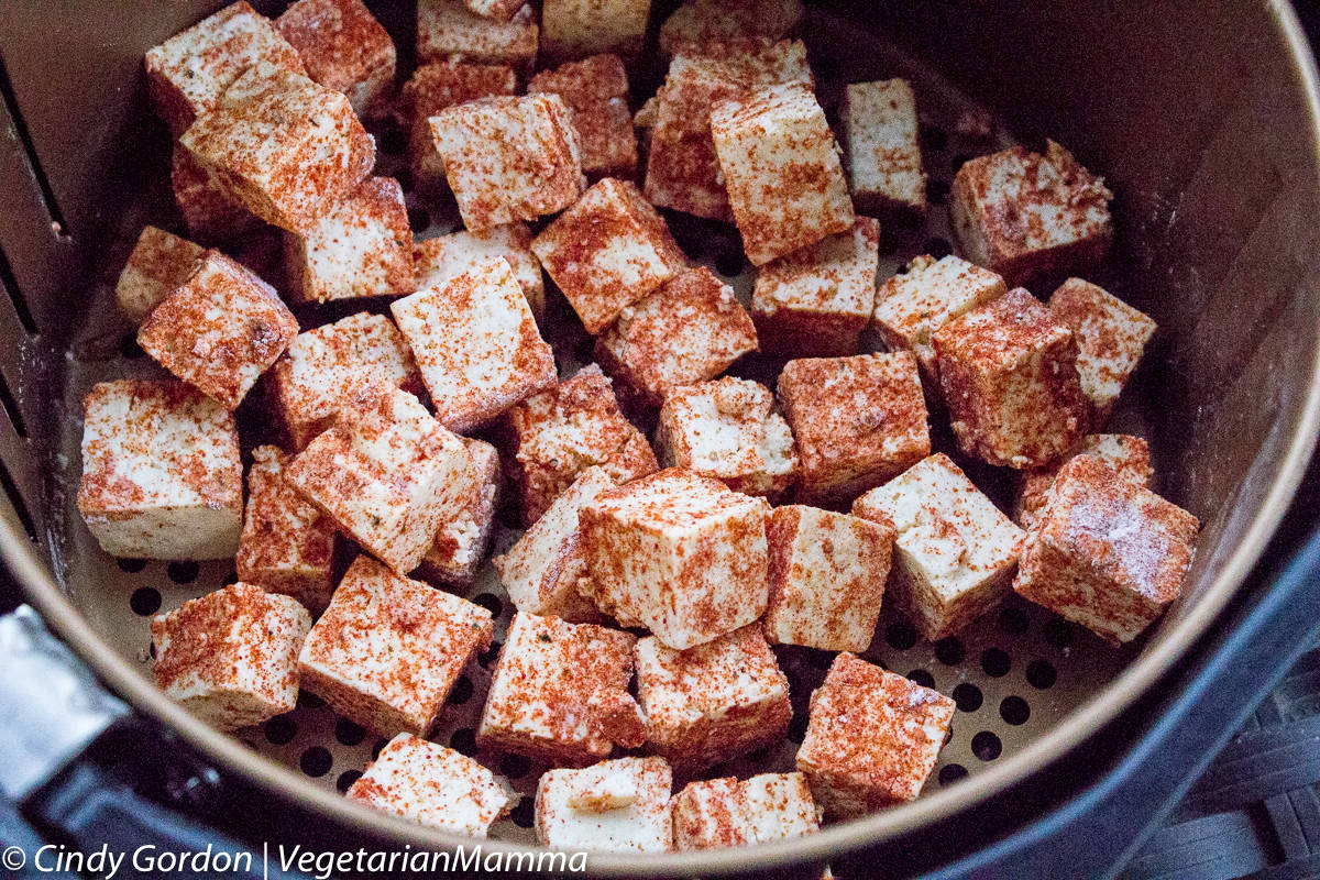 Air Fryer Tofu with Smoked Paprika chunks in the air fryer basket