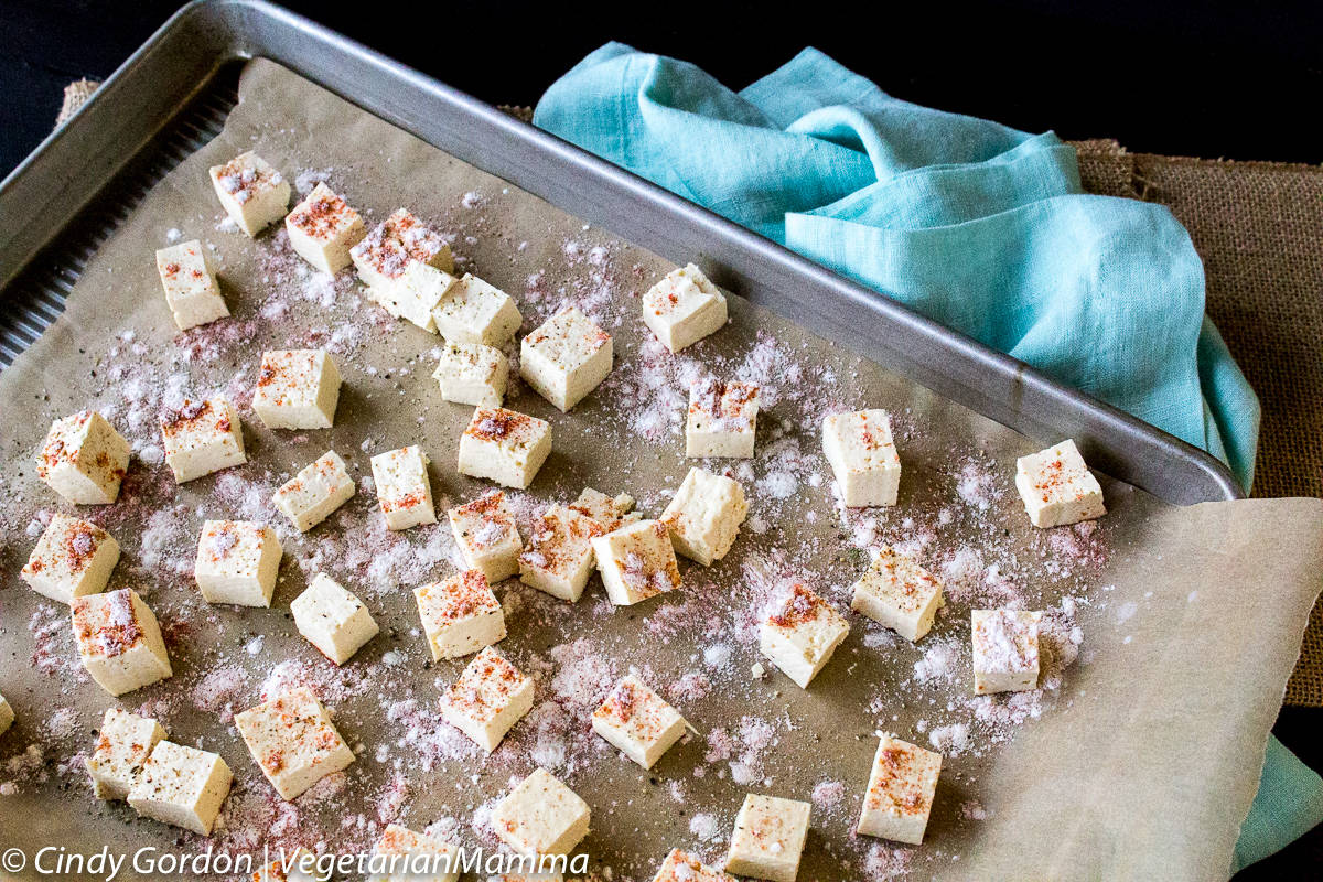 Prepping the Air Fryer Tofu with Smoked Paprika on a baking sheet