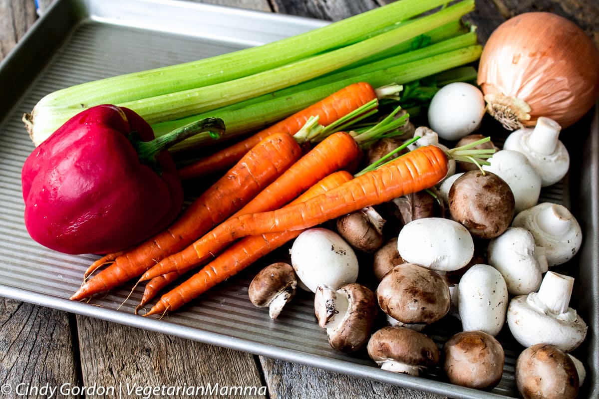 cookie sheets with fresh vegetables for veggie bolognese sauce