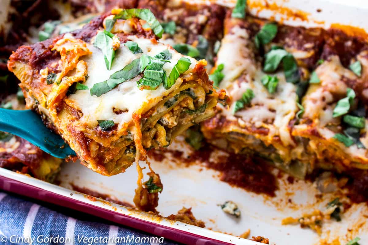 spatula lifting a slice of Spinach Mushroom Lasagna out of the pan