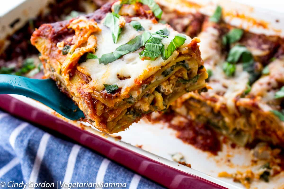 spatula lifting a slice of Spinach Mushroom Lasagna out of the pan