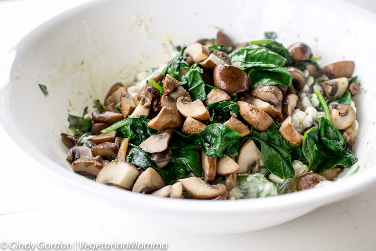 mushrooms and spinach added to ricotta mixture for lasagna