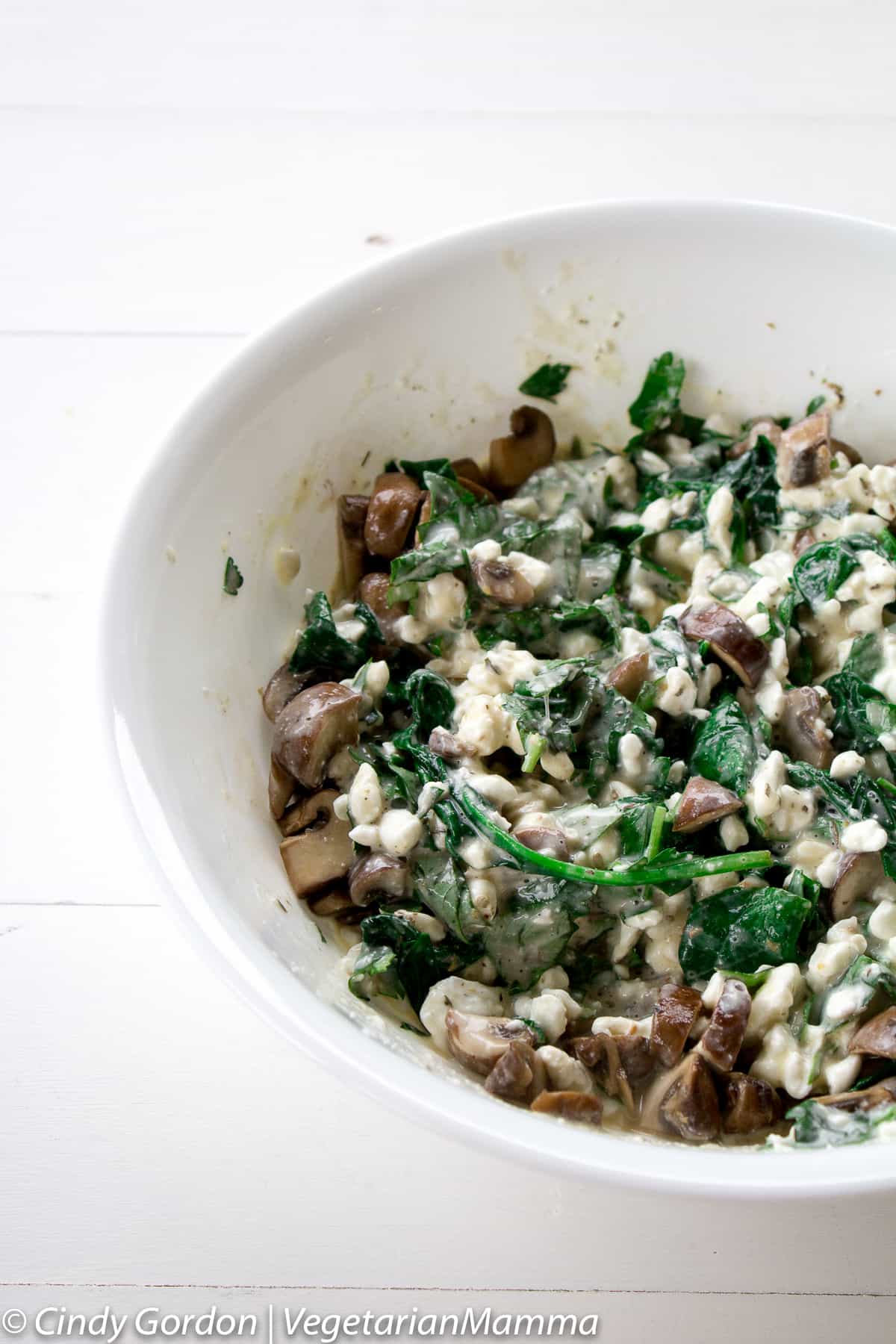 spinach mushroom ricotta mixture in bowl for lasagna