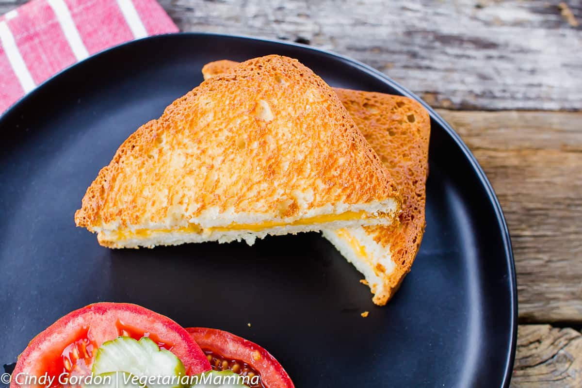 Air Fryer Grilled Cheese cut in half on a plate