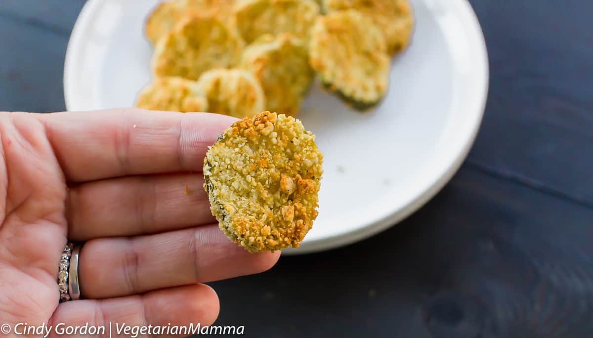 Air Fryer Fried Pickles close up in someone's hand.