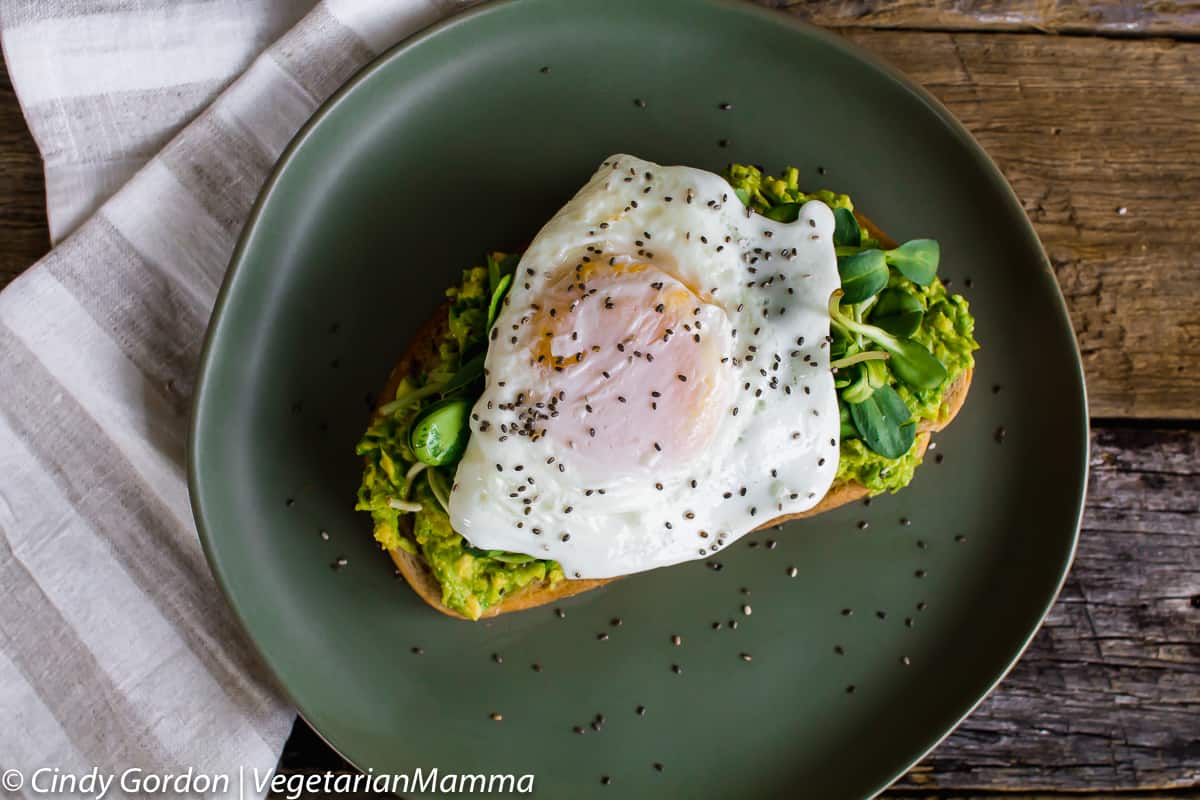 Fried Egg Avocado Toast topped with chia seeds