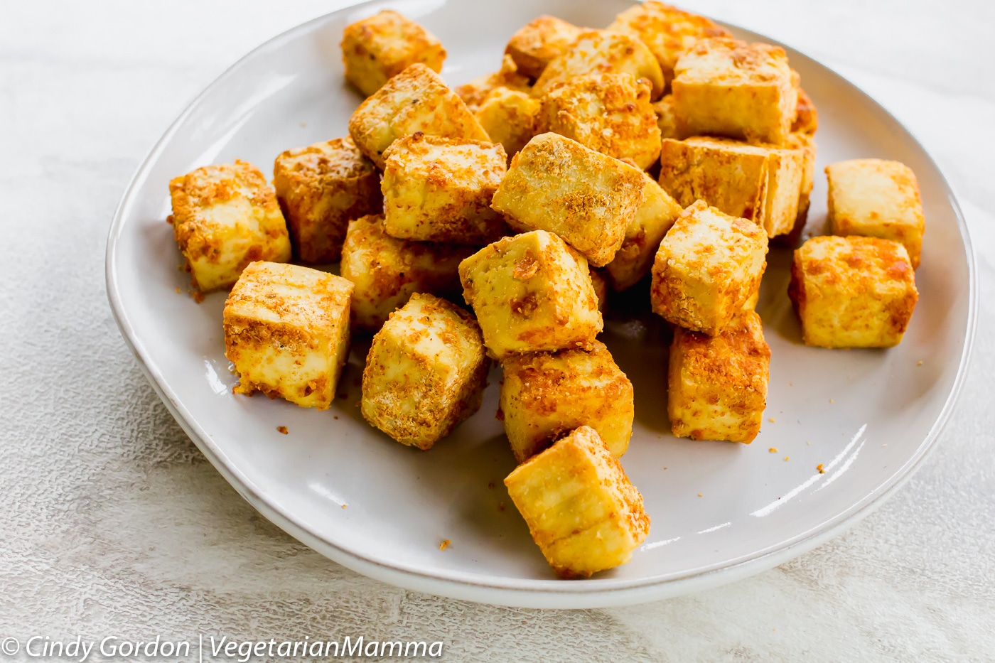 Crispy Air Fryer Tofu cubes on a plate