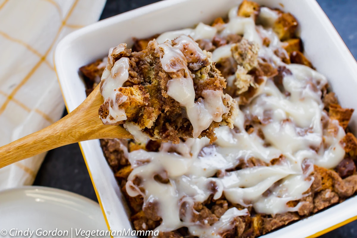 A spoon full of Cinnamon Roll French Toast Casserole