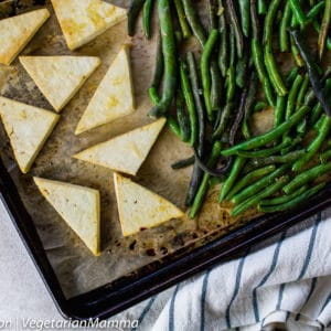 Lemon Tofu and beans on sheet pan with striped cloth