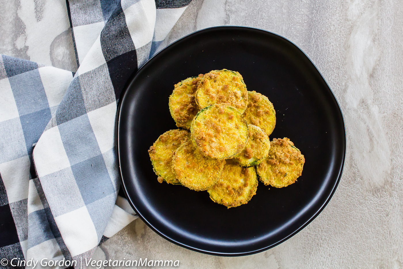 Air Fryer Zucchini Coins on a plate with a napkin