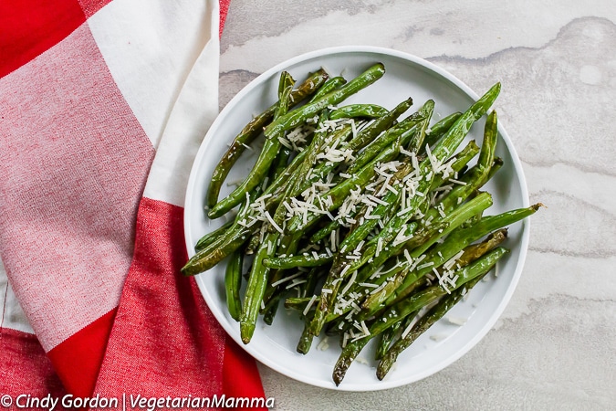 Air Fryer Green Beans can be toped with parmesan cheese.