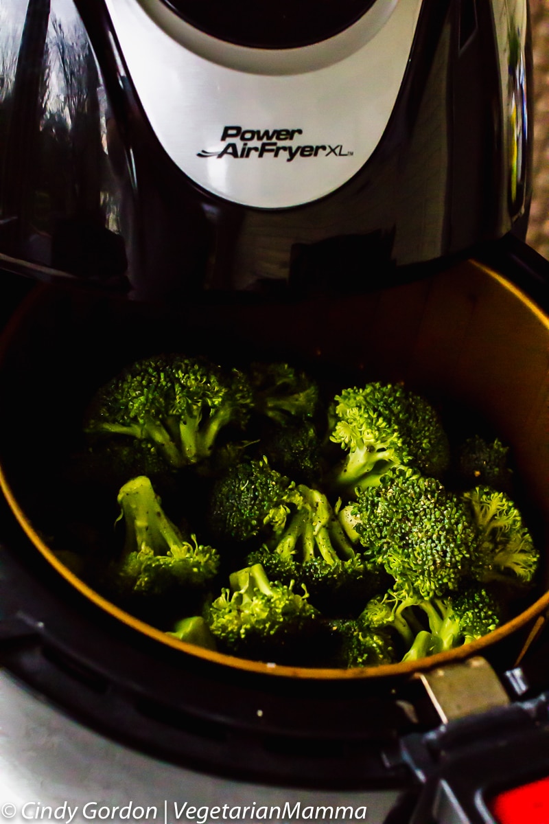 Air Fryer Broccoli in the air fryer basket in a power fryer xl