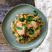 Crispy gluten-free eggplant parmesan served over pasta