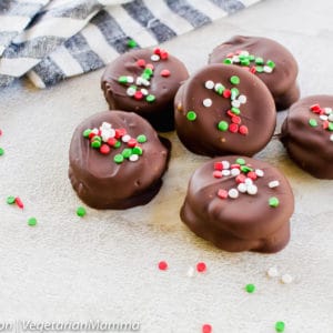 Close up view of tagalong cookies atop white and gray table