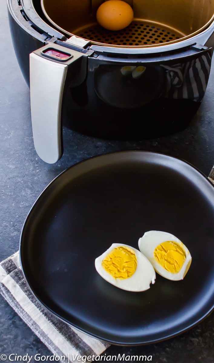 hard boiled egg cut in half on a plate