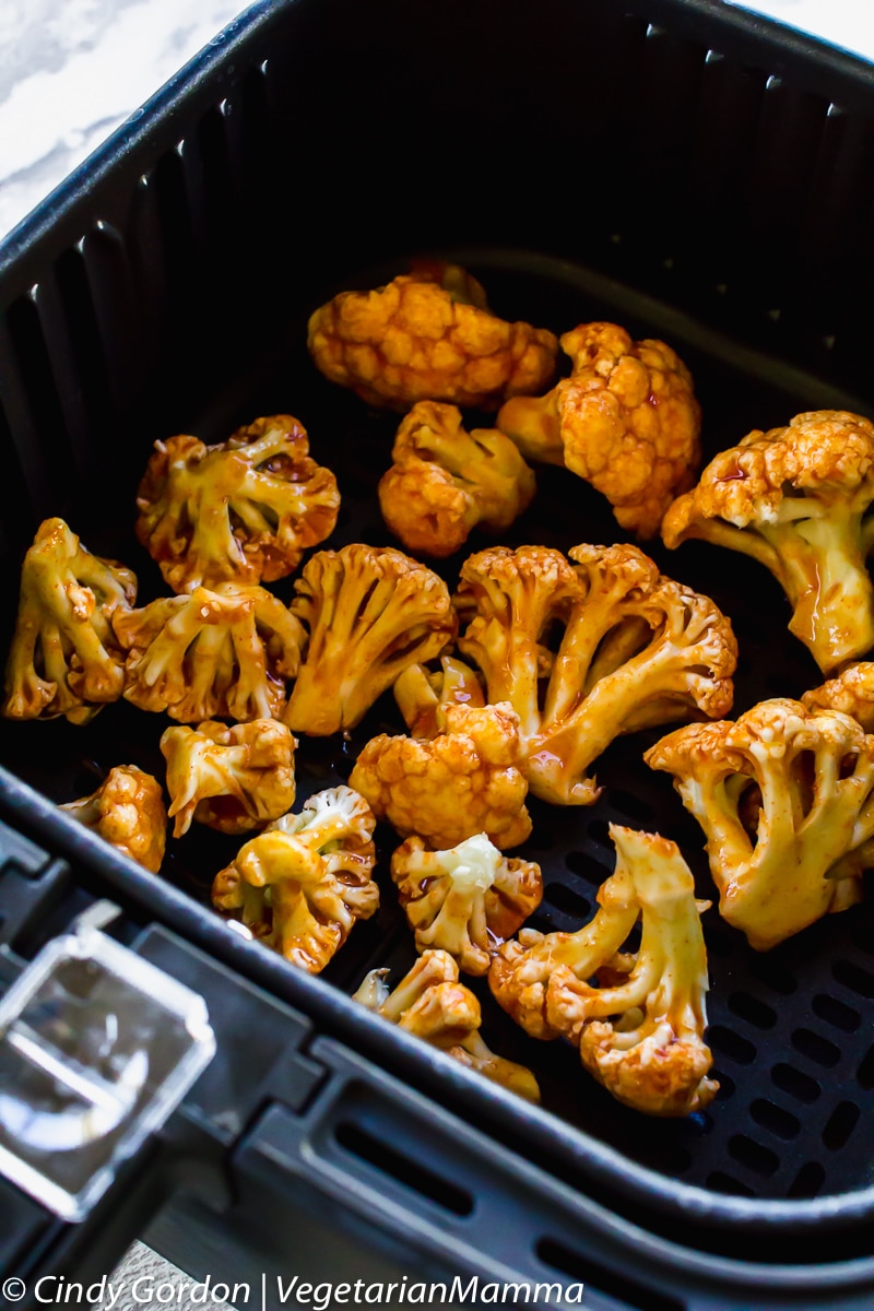 Honey Sriracha Cauliflower in air fryer basket