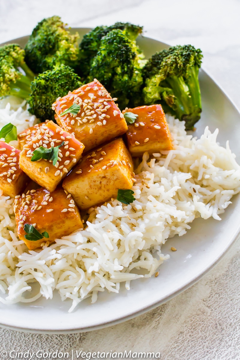 Honey Sriracha Tofu  served on top of rice with broccoli.