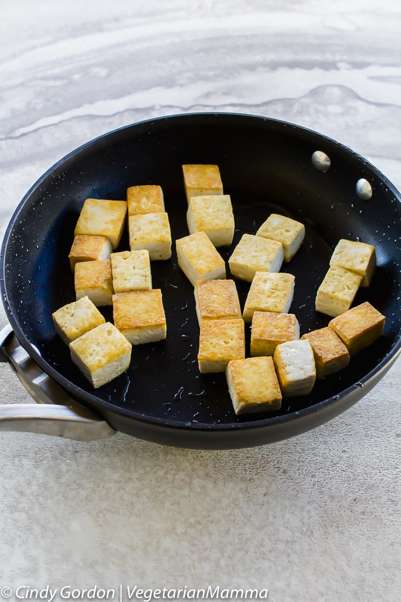 Honey Sriracha Tofu fried in a pan