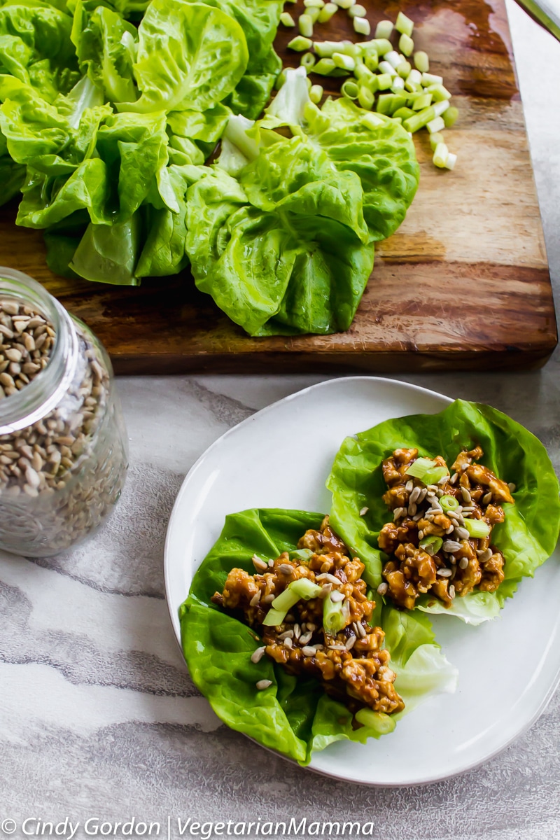 Two tofu lettuce wraps dressed with a homemade Thai dressing