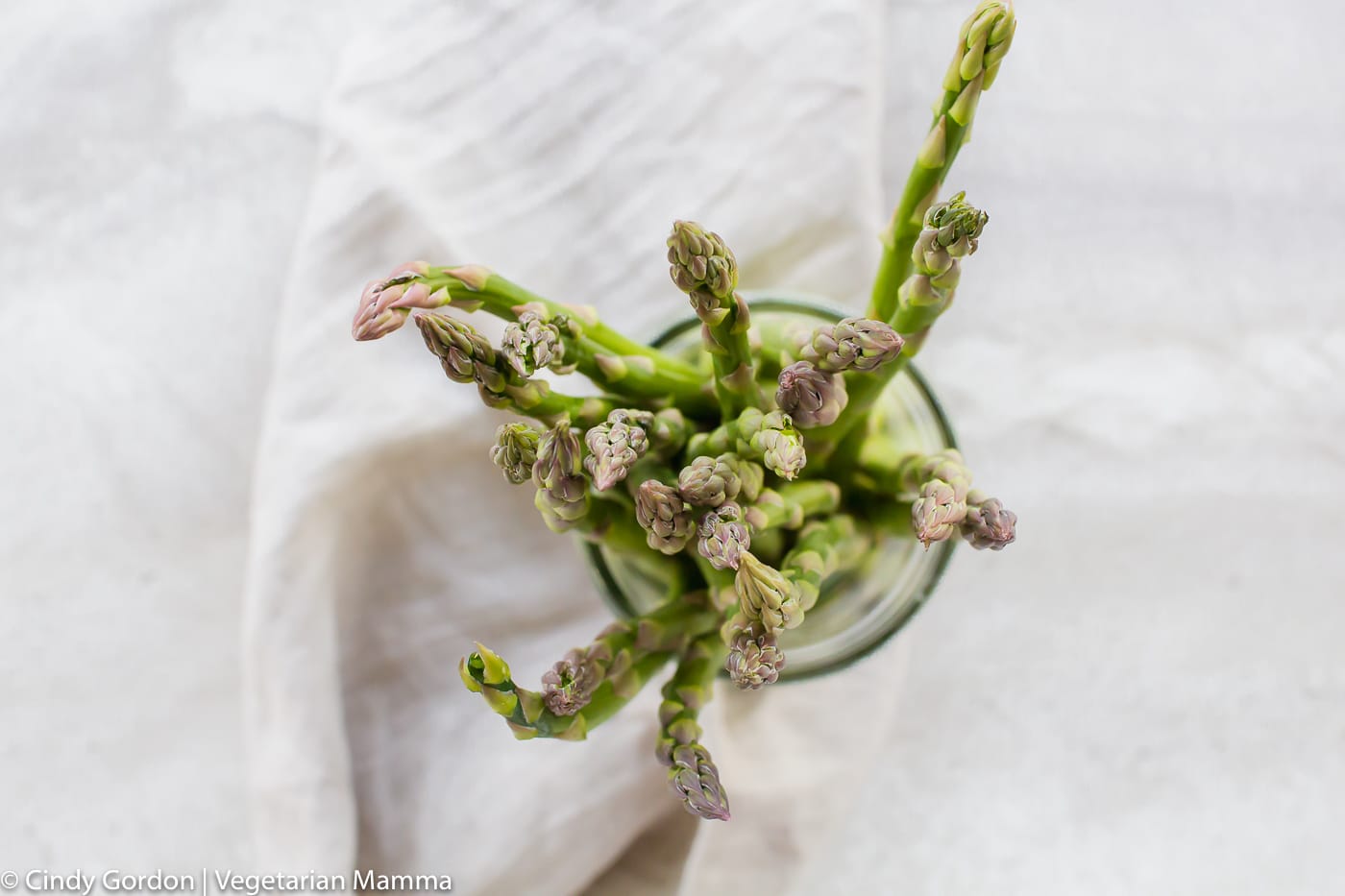 stalks of fresh asparagus in a cup