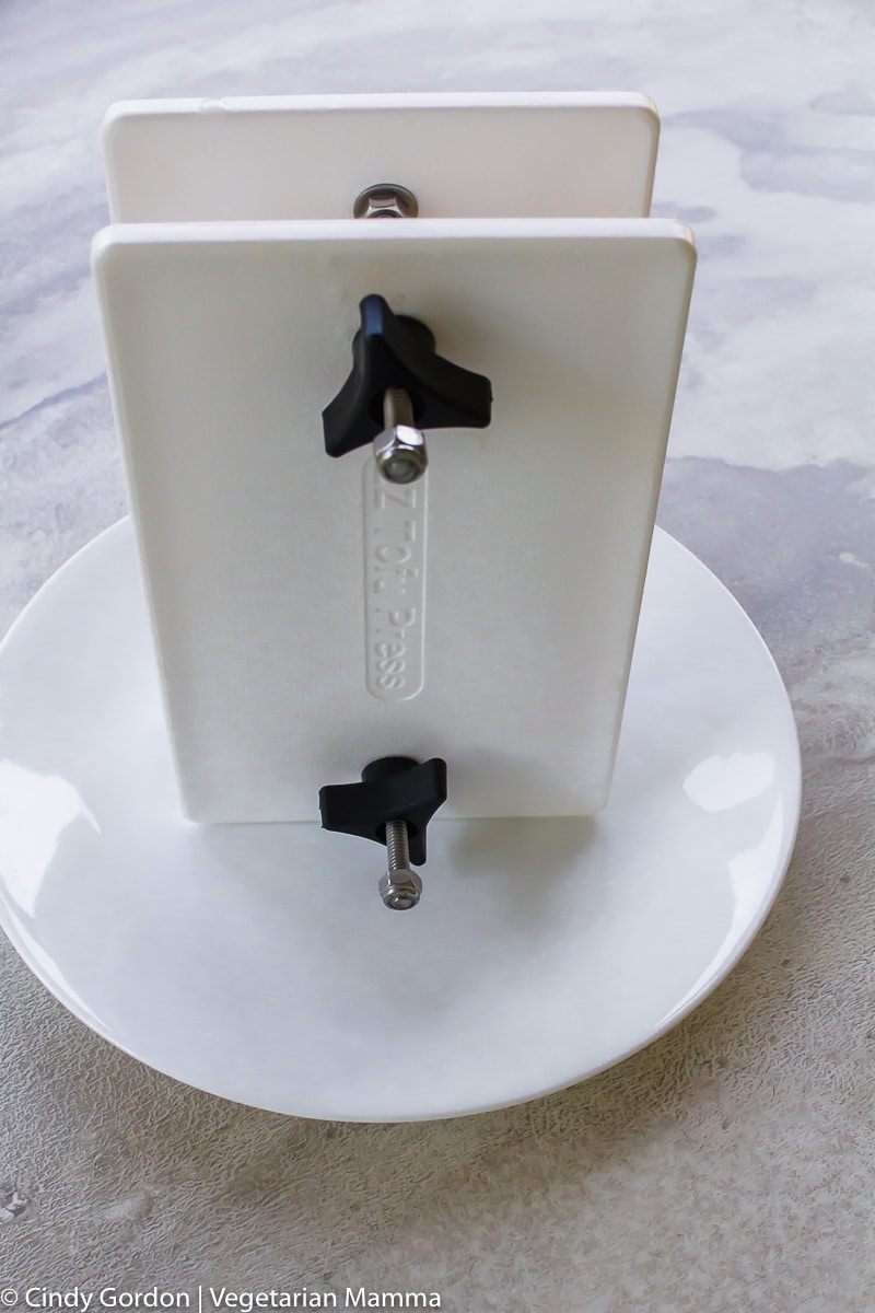 picture of an ez tofu press on a white plate