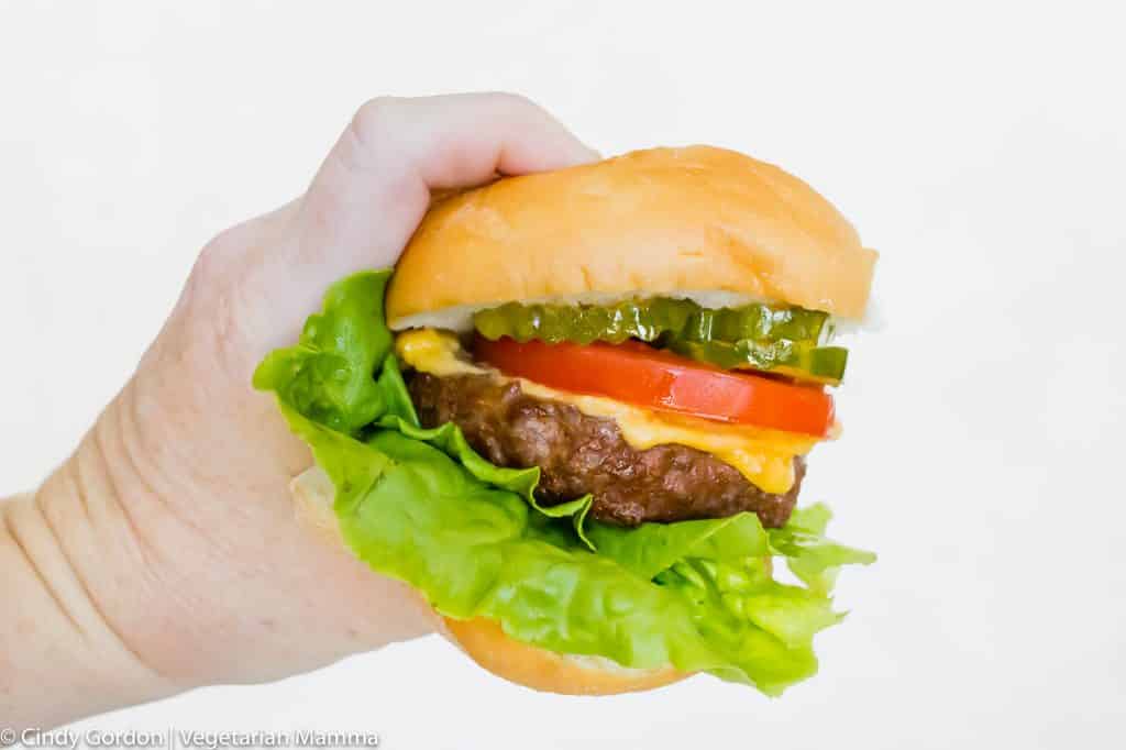 Air Fryer Hamburger held in a hand