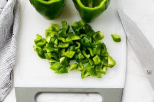 diced green bell pepper on cutting board