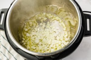 instant pot with onions in it and oil