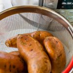 sweet potatoes in a colander beside an instant pot