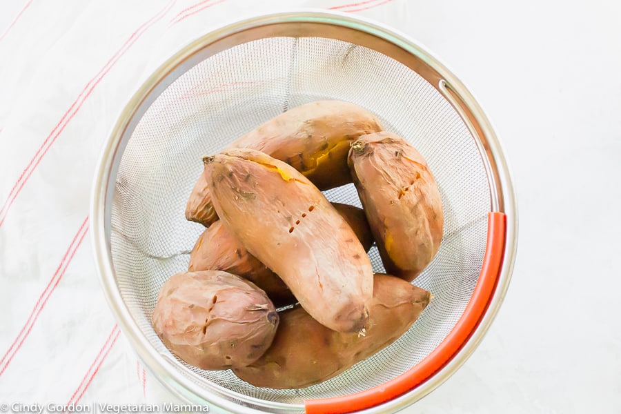 cooked instant pot sweet potatoes in a colande
