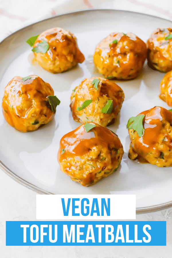 Vegan Meatballs are glazed in a sweet sauce and perfect for parties! These tofu "meatballs" are packed with red onion, parsley, oregano, and a little liquid smoke and baked for half an hour for a tender and delicious vegetarian appetizer. #tofumeatballs #appetizer #vegan