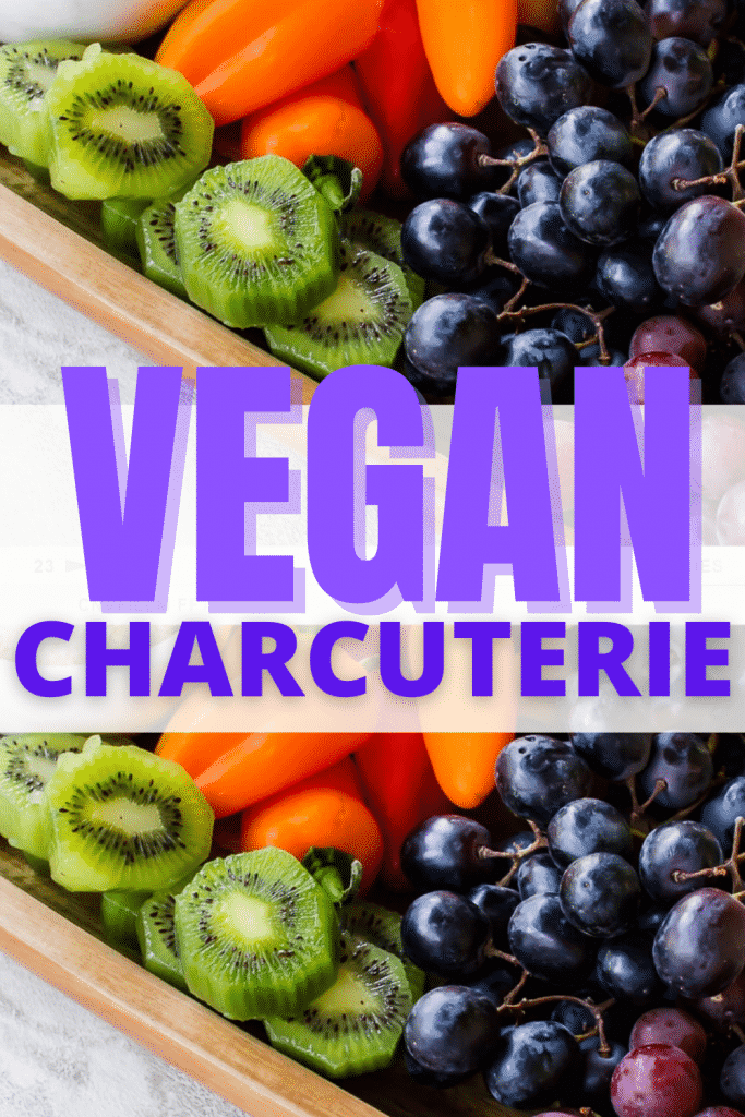 VEGAN CHARCUTERIE BOARD PINNABLE IMAGE OF A BOARD WITH FRUITS AND VEGETABLES