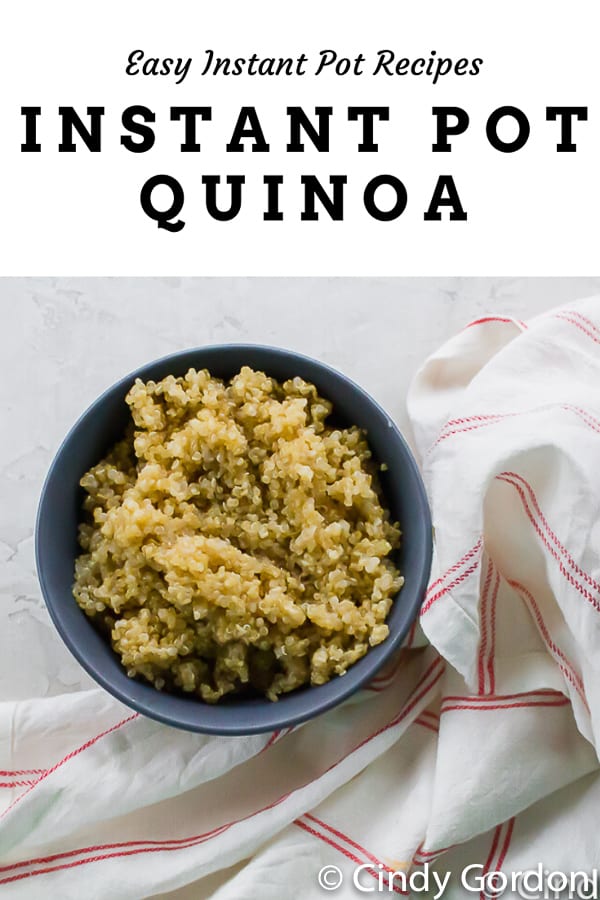 A blue bowl of quinoa with a red and white kitchen towel and overlay text