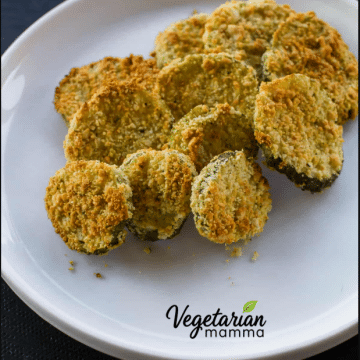 Crispy fried pickles on a white plate