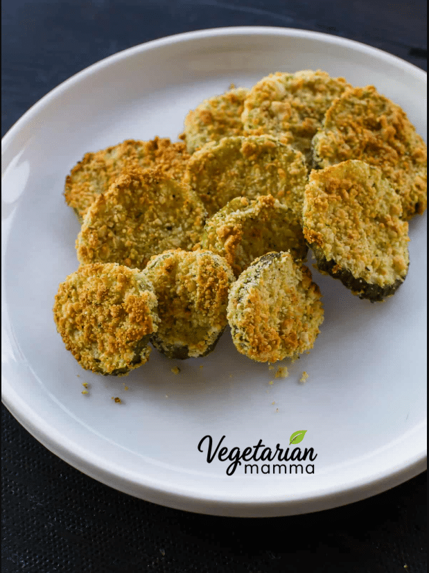 Crispy fried pickles on a white plate