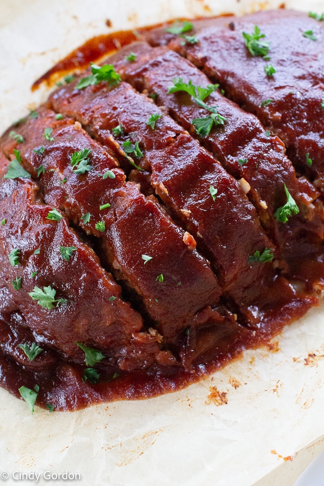 Close-up shot of a glazed Beyond Meat meatloaf garnished with parsley