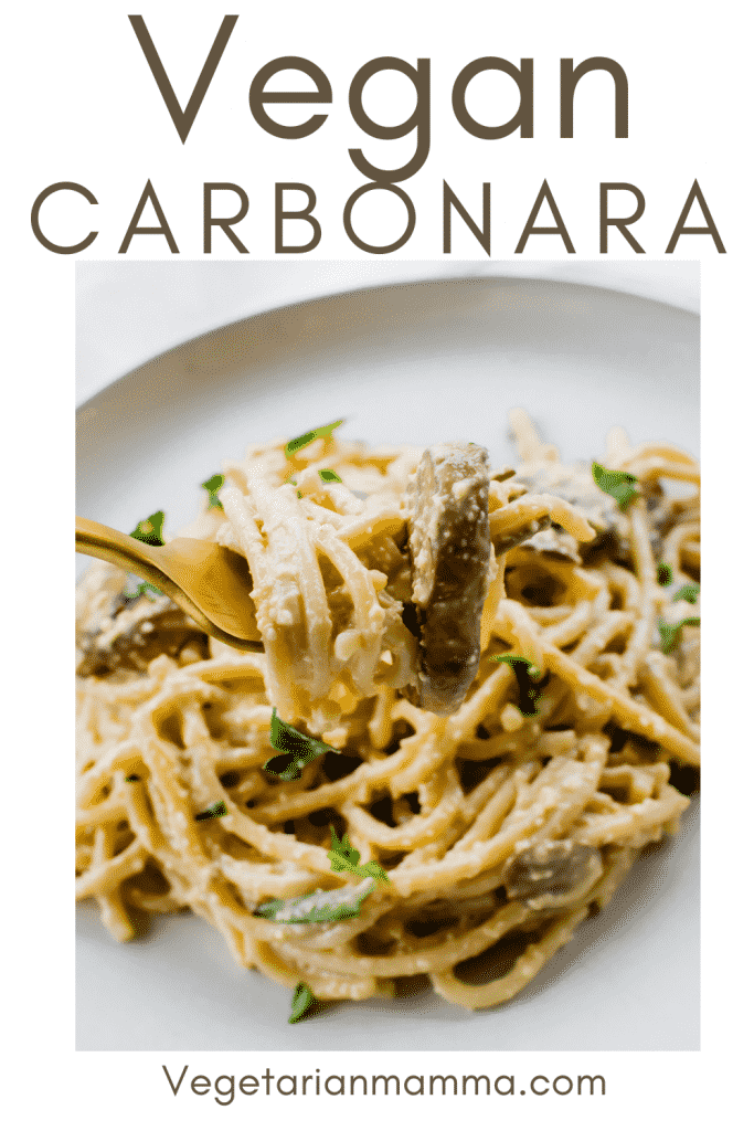 Close-up shot of mushroom carbonara on a gold fork over a white plate with overlay text
