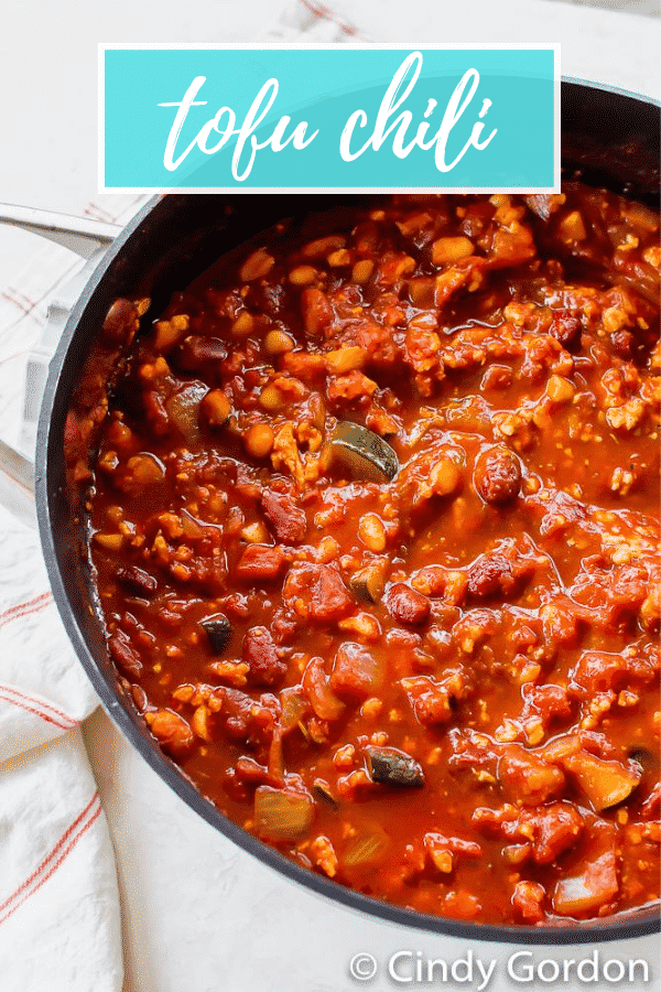 Hearty Tofu Chili is the best vegan comfort food. You can make this chili recipe in less than an hour with tons of succulent veggies and protein-packed beans. #vegansoup #veganrecipes
