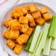 Crispy air fryer Buffalo tofu served with celery sticks