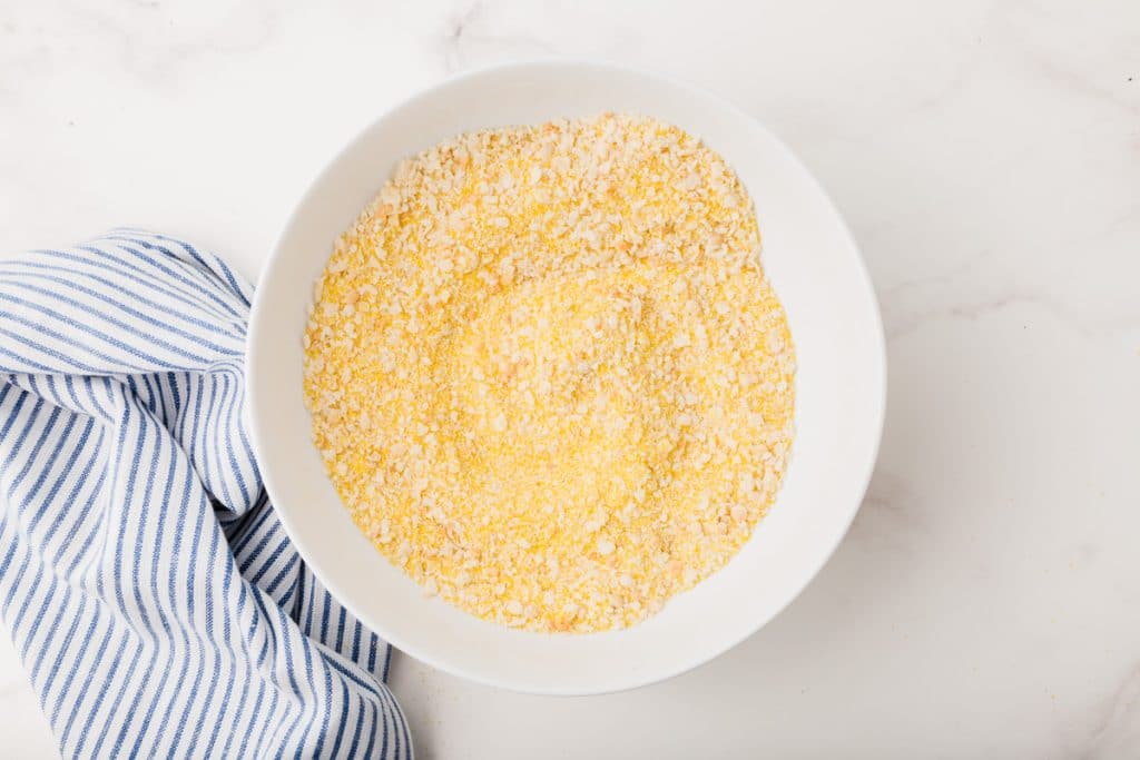 white bowl with cornmeal mixture
